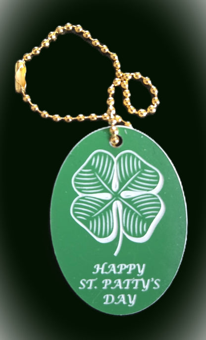 AC Angle Charm a Green tag with a four-leaf clover and 'Happy St. Patty's Day' text with a gold 7 inch chain.