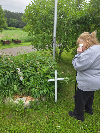 Loved one standing next to their Loved ones memorial and remember the time shared.  Engraving customizes and tells their story.  