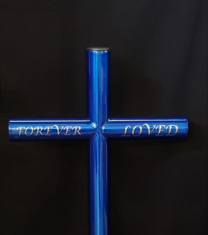 Vibrant Blue Everlasting Cross Is A Joyful Remembrance. Custom Engraved with Forever Loved in Lucida Calligraphy font on the Left and Right Horizonal. Black plastic end caps shown and the option is available for a Cremation Urn or Capsule.  Place in Cemetery, Gravesite, Roadside, Garden or Pets Favorite Spot in the Yard. 
