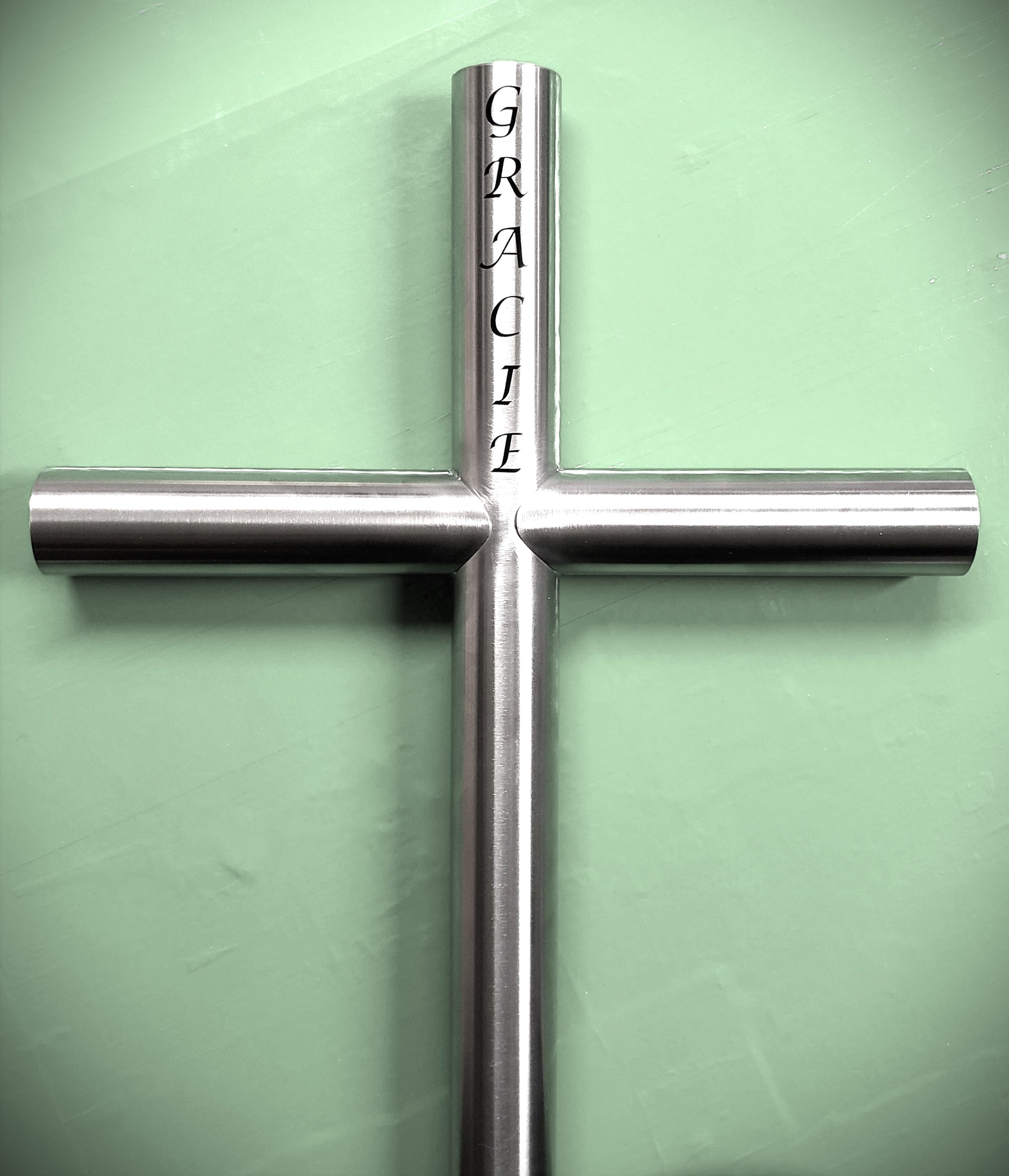 Stainless Steel Everlasting Cross Memorial Is Custom Engraved in Lucinda Calligraphy Font and Will Hold Memories In A Timeless Memorial Urn for Your Loved One Loss. Final Resting Place Can Be Gravesite, Roadside, Favorite Place, Garden. 