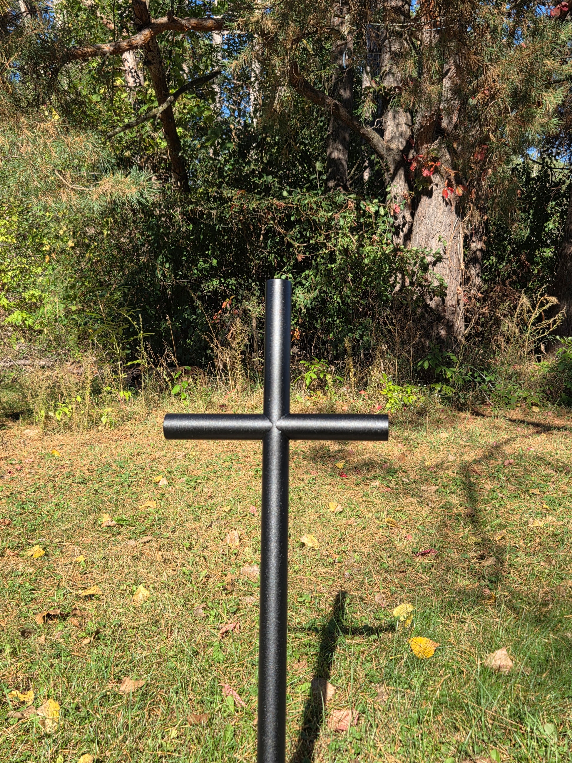 Sunlight dances off the Black Ebony finish as it memorializes their friend lost tragically.  Everlasting Cross memorial will stand tall forever remembering them.