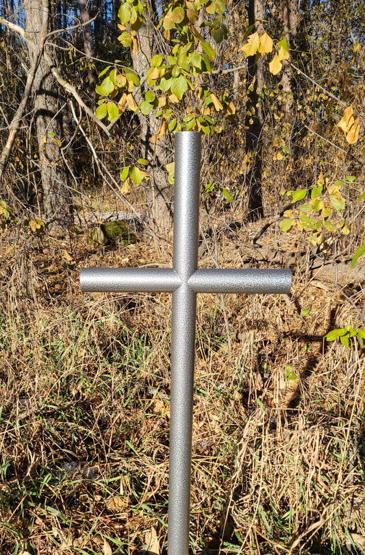 Everlasting Cross Memorial, small 13 inch wide by 32 inch tall. Placed next to trees in the fall.  Silver Vein finish with open end caps.