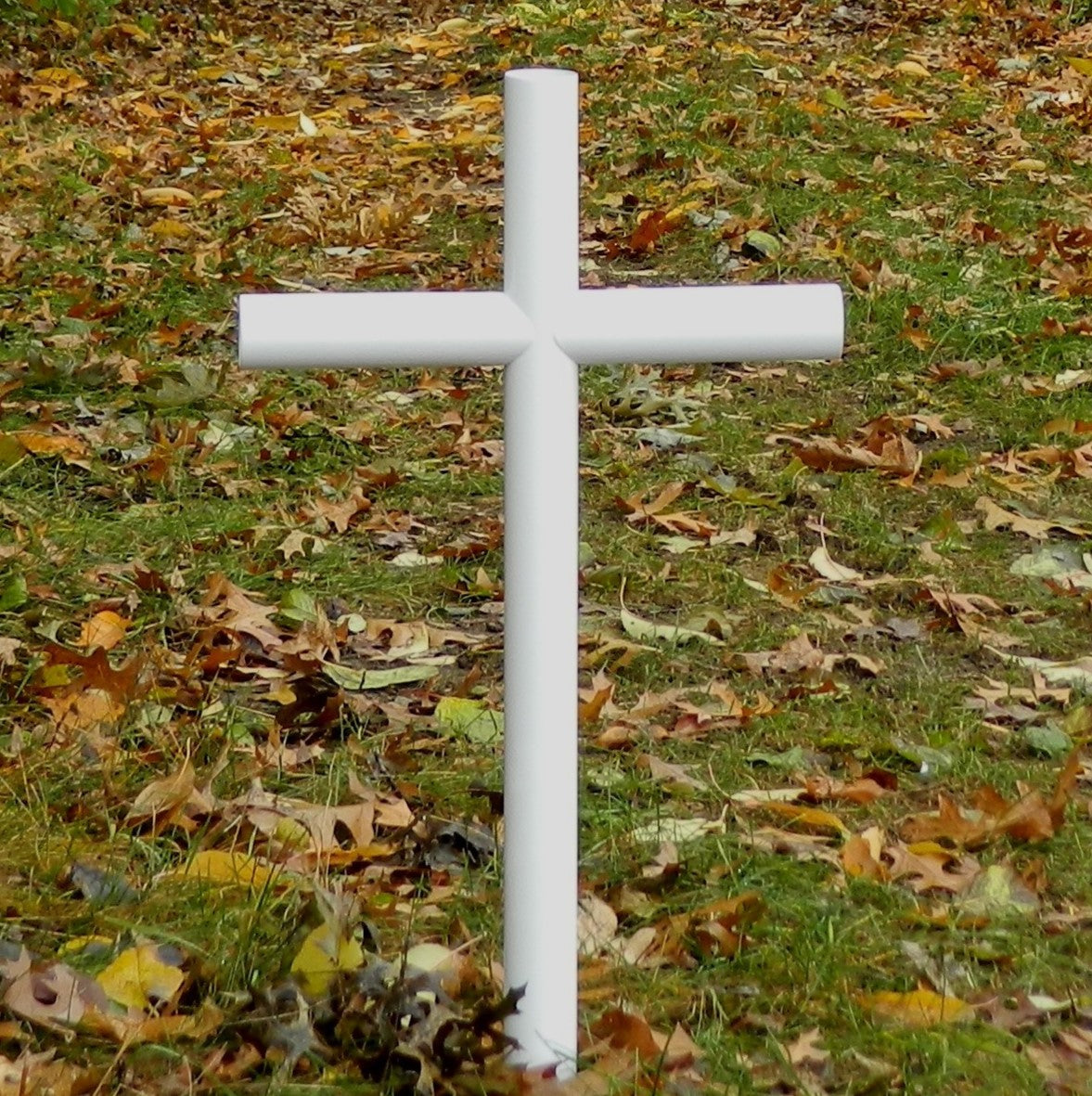 Close view of the White finish Everlasting Cross Memorial.  Captures The Pure Love We Have For Our Loved One Loss. This Memorial Will Endure Time For The One Who Has Passed.