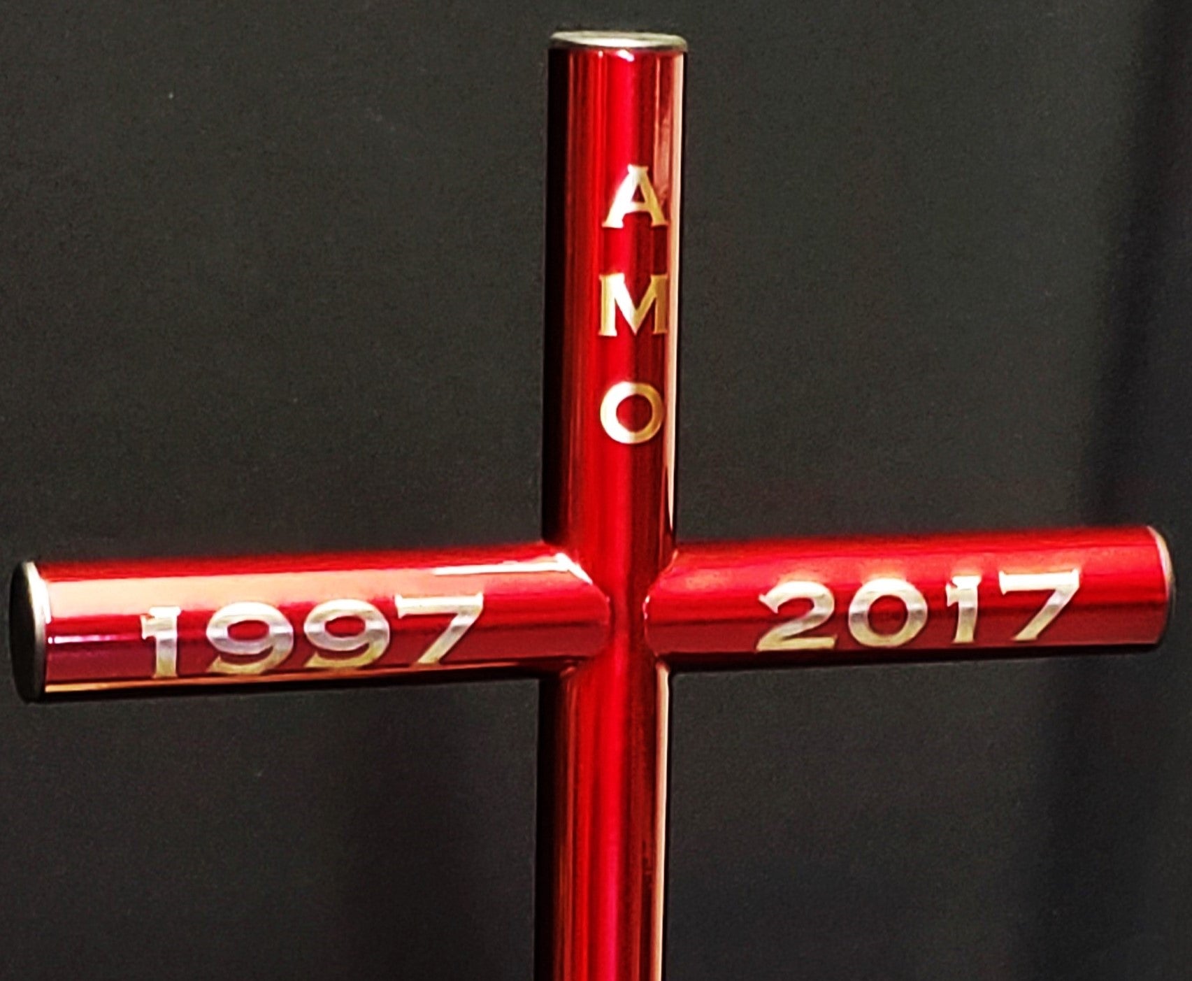 Everlasting Cross is viewed up close of the Copperplate engraving on the top vertical and left and right horizontal placement.  Chosen finish is Red with black plastic end caps and no Urn Capsule options.  